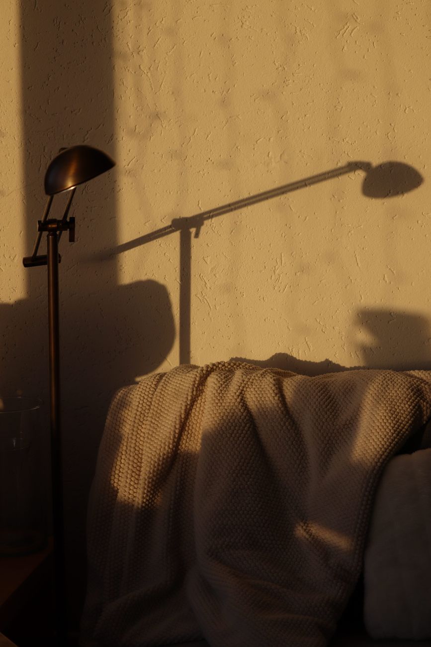 Sunlight casting natural shadow inside modern high ceiling room